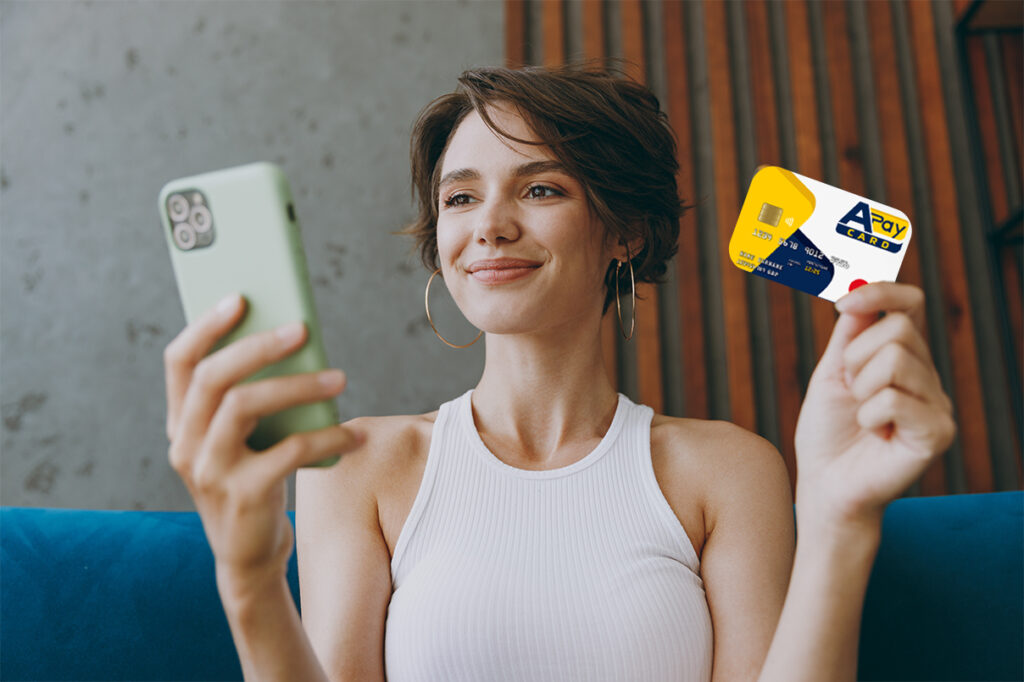 Pagamento online bollettini: Ragazza effettua pagamento bollettini con APay E-Wallet e APay Card