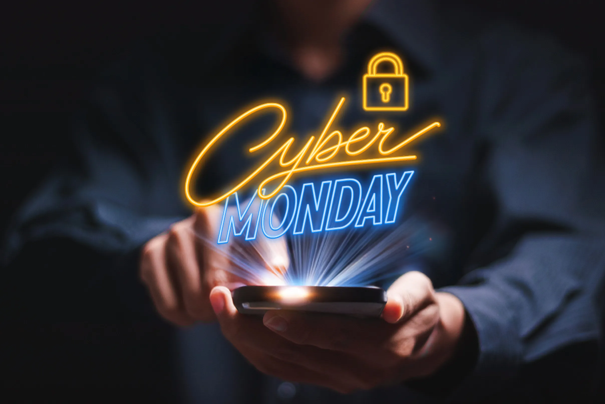 Persona che utilizza uno smartphone con scritta luminosa Cyber Monday, simbolo delle offerte digitali e promozioni online di APay E-Wallet per il Cyber Monday.